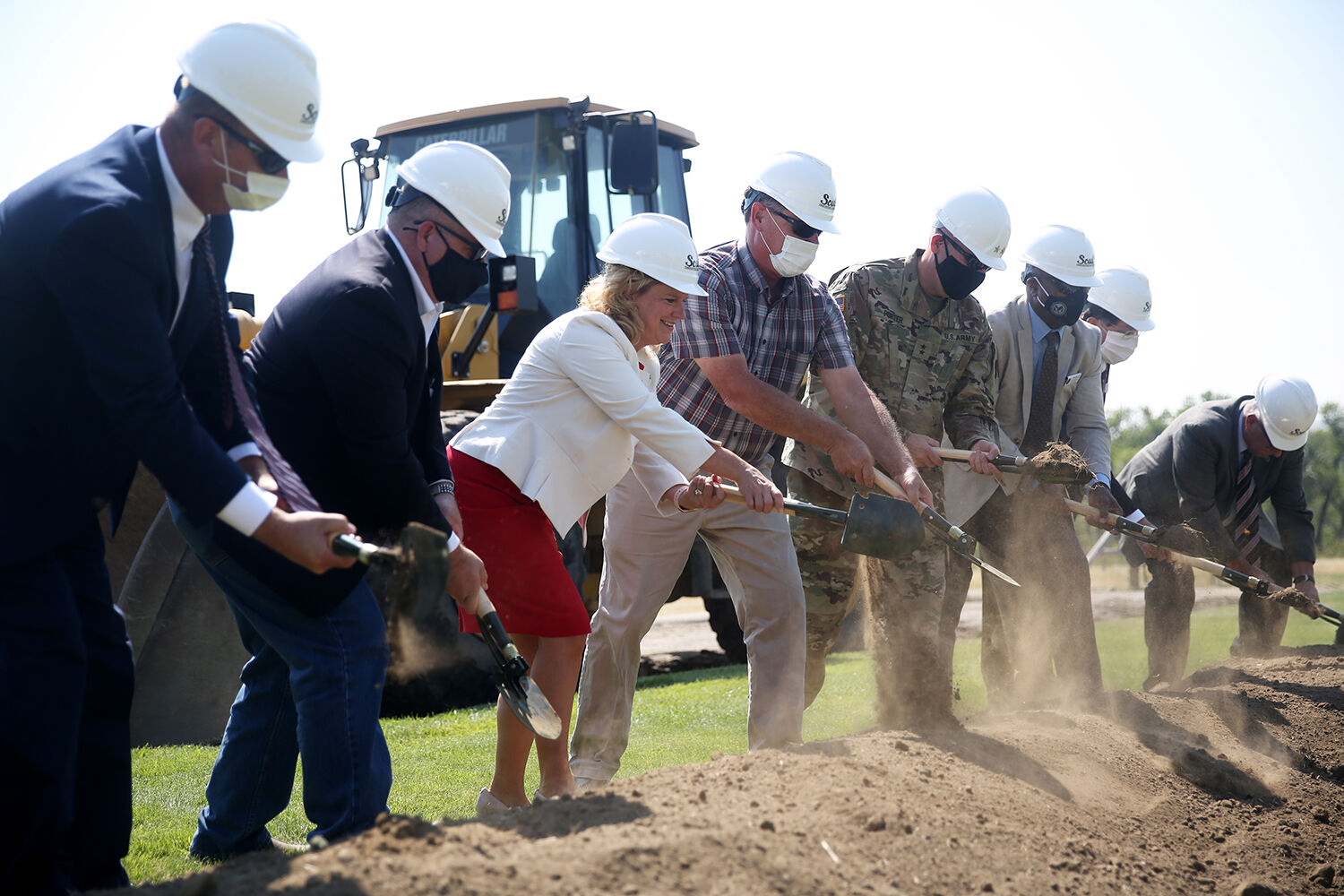 The first group of groundbreakers uses the military entrenchment tools